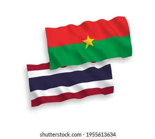 National vector fabric wave flags of Burkina Faso and Thailand isolated on white background. 1 to 2 proportion.