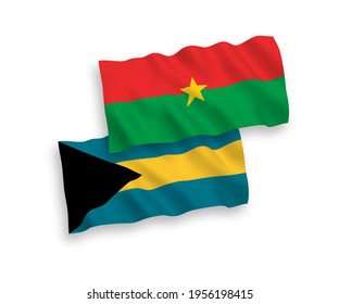 National vector fabric wave flags of Burkina Faso and Commonwealth of The Bahamas isolated on white background. 1 to 2 proportion.