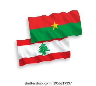 National vector fabric wave flags of Burkina Faso and Lebanon isolated on white background. 1 to 2 proportion.