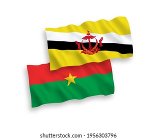 National vector fabric wave flags of Burkina Faso and Brunei isolated on white background. 1 to 2 proportion.