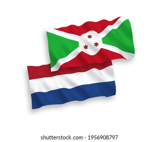 National vector fabric wave flags of Burundi and Netherlands isolated on white background. 1 to 2 proportion.