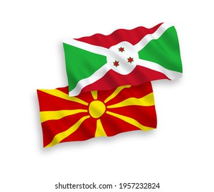 National vector fabric wave flags of Burundi and North Macedonia isolated on white background. 1 to 2 proportion.