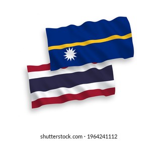 National vector fabric wave flags of Republic of Nauru and Thailand isolated on white background. 1 to 2 proportion.