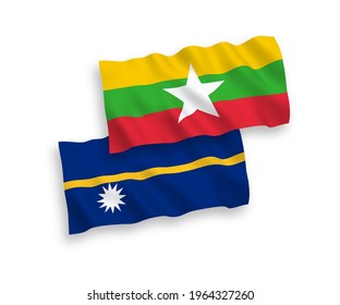National vector fabric wave flags of Republic of Nauru and Myanmar isolated on white background. 1 to 2 proportion.