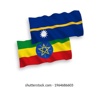 National vector fabric wave flags of Republic of Nauru and Ethiopia isolated on white background. 1 to 2 proportion.