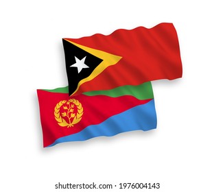 National vector fabric wave flags of Eritrea and East Timor isolated on white background. 1 to 2 proportion.3D