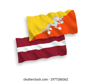 National vector fabric wave flags of Latvia and Kingdom of Bhutan isolated on white background. 1 to 2 proportion.