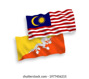 National vector fabric wave flags of Kingdom of Bhutan and Malaysia isolated on white background. 1 to 2 proportion.