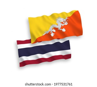 National vector fabric wave flags of Kingdom of Bhutan and Thailand isolated on white background. 1 to 2 proportion.