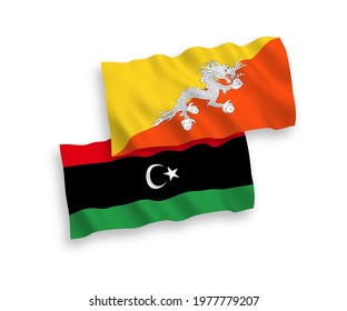 National vector fabric wave flags of Kingdom of Bhutan and Libya isolated on white background. 1 to 2 proportion.