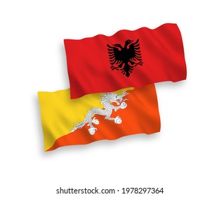 National vector fabric wave flags of Kingdom of Bhutan and Albania isolated on white background. 1 to 2 proportion.