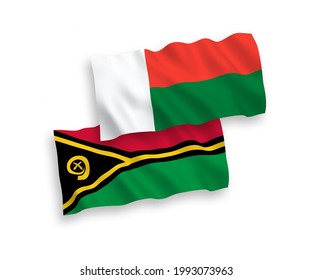 National vector fabric wave flags of Republic of Vanuatu and Madagascar isolated on white background. 1 to 2 proportion.