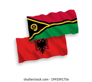 National vector fabric wave flags of Republic of Vanuatu and Albania isolated on white background. 1 to 2 proportion.
