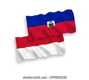 Banderas de olas de tela vectorial nacional de Indonesia y la República de Haití aisladas en fondo blanco. de 1 a 2.