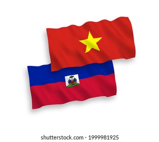 Banderas nacionales de tela vectorial ondeando banderas de la República de Haití y Vietnam aisladas en fondo blanco. de 1 a 2.