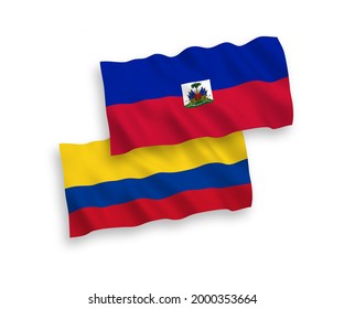 National vector fabric wave flags of Republic of Haiti and Colombia isolated on white background. 1 to 2 proportion.