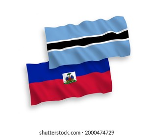 National vector fabric wave flags of Republic of Haiti and Botswana isolated on white background. 1 to 2 proportion.