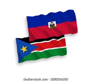 National vector fabric wave flags of Republic of Haiti and Republic of South Sudan isolated on white background. 1 to 2 proportion.