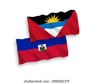Nationale Vektor-Wellen-Flaggen der Republik Haiti und Antigua und Barbuda einzeln auf weißem Hintergrund. 1 bis 2 %.