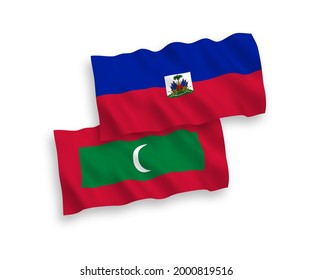 National vector fabric wave flags of Republic of Haiti and Maldives isolated on white background. 1 to 2 proportion.