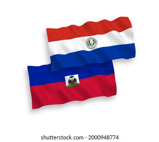 National vector fabric wave flags of Republic of Haiti and Paraguay isolated on white background. 1 to 2 proportion.