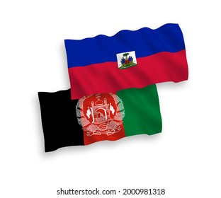 National vector fabric wave flags of Republic of Haiti and Islamic Republic of Afghanistan isolated on white background. 1 to 2 proportion.