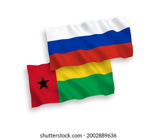 Banderas de olas de tela vectorial nacional de la República de Guinea Bissau y Rusia aisladas en fondo blanco. de 1 a 2.
