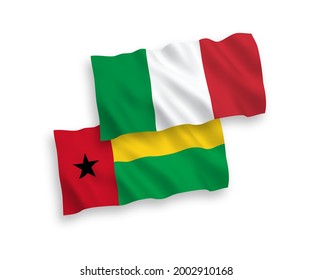 National vector fabric wave flags of Italy and Republic of Guinea Bissau isolated on white background. 1 to 2 proportion.