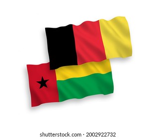 National vector fabric wave flags of Republic of Guinea Bissau and Belgium isolated on white background. 1 to 2 proportion.