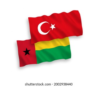 National vector fabric wave flags of Turkey and Republic of Guinea Bissau isolated on white background. 1 to 2 proportion.