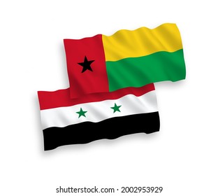 National vector fabric wave flags of Republic of Guinea Bissau and Syria isolated on white background. 1 to 2 proportion.