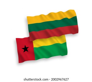 National vector fabric wave flags of Lithuania and Republic of Guinea Bissau isolated on white background. 1 to 2 proportion.