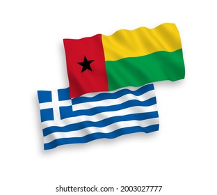 National vector fabric wave flags of Greece and Republic of Guinea Bissau isolated on white background. 1 to 2 proportion.