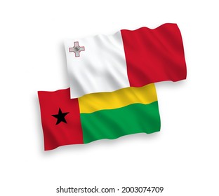 National vector fabric wave flags of Malta and Republic of Guinea Bissau isolated on white background. 1 to 2 proportion.