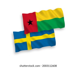 National vector fabric wave flags of Sweden and Republic of Guinea Bissau isolated on white background. 1 to 2 proportion.