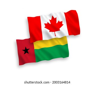 National vector fabric wave flags of Canada and Republic of Guinea Bissau isolated on white background. 1 to 2 proportion.
