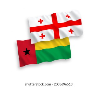 National vector fabric wave flags of Republic of Guinea Bissau and Georgia isolated on white background. 1 to 2 proportion.