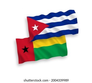 National vector fabric wave flags of Republic of Guinea Bissau and Cuba isolated on white background. 1 to 2 proportion.