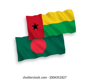 National vector fabric wave flags of Republic of Guinea Bissau and Bangladesh isolated on white background. 1 to 2 proportion.