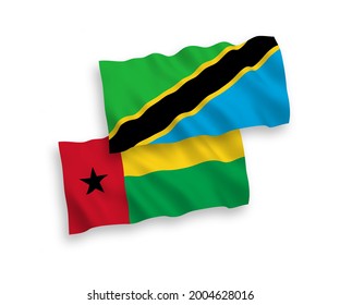 Nationale Vektor-Wellen-Flaggen der Republik Guinea-Bissau und Tansanias einzeln auf weißem Hintergrund. 1 bis 2 %.