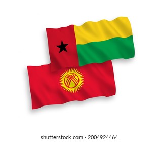 National vector fabric wave flags of Republic of Guinea Bissau and Kyrgyzstan isolated on white background. 1 to 2 proportion.