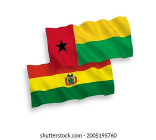 National vector fabric wave flags of Republic of Guinea Bissau and Bolivia isolated on white background. 1 to 2 proportion.