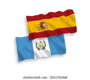 National vector fabric wave flags of Republic of Guatemala and Spain isolated on white background. 1 to 2 proportion.