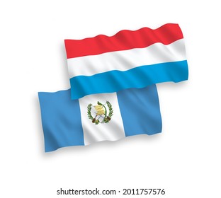 National vector fabric wave flags of Republic of Guatemala and Luxembourg isolated on white background. 1 to 2 proportion.