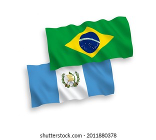 National vector fabric wave flags of Brazil and Republic of Guatemala isolated on white background. 1 to 2 proportion.