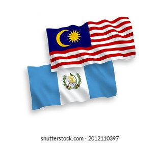National vector fabric wave flags of Republic of Guatemala and Malaysia isolated on white background. 1 to 2 proportion.