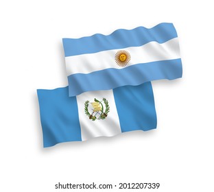 National vector fabric wave flags of Republic of Guatemala and Argentina isolated on white background. 1 to 2 proportion.