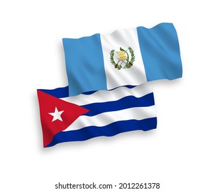 National vector fabric wave flags of Republic of Guatemala and Cuba isolated on white background. 1 to 2 proportion.