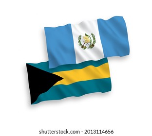 National vector fabric wave flags of Republic of Guatemala and Commonwealth of The Bahamas isolated on white background. 1 to 2 proportion.