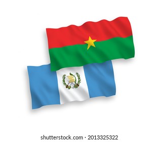 National vector fabric wave flags of Republic of Guatemala and Burkina Faso isolated on white background. 1 to 2 proportion.